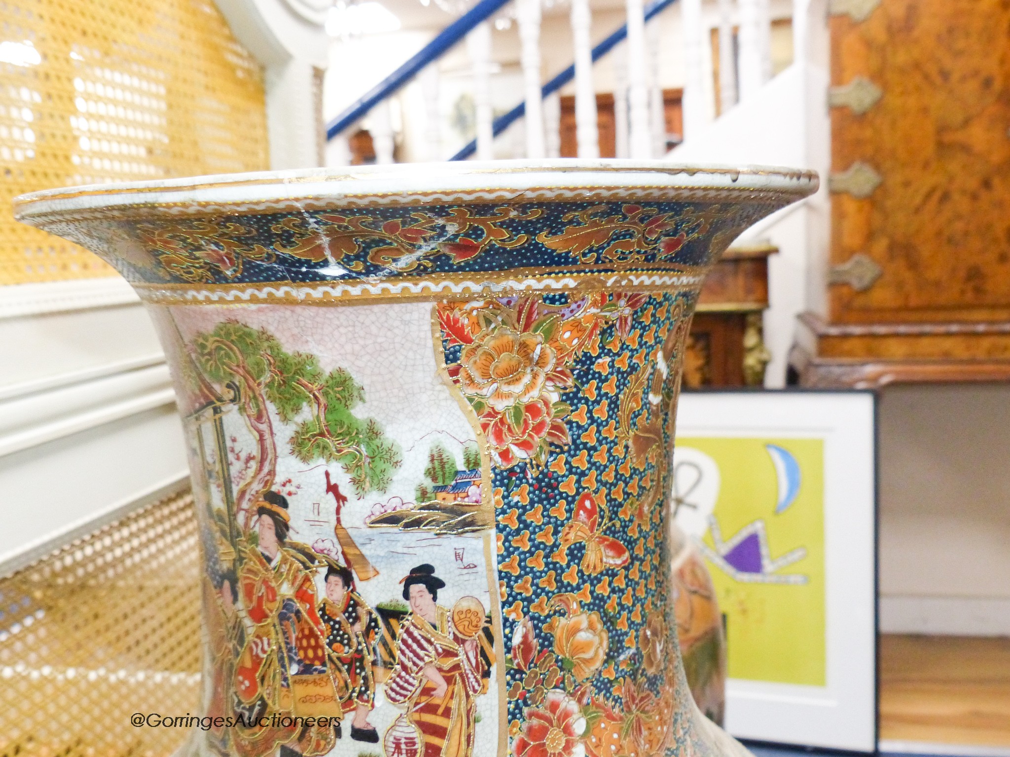 A pair of large Japanese vases, on hardwood stands